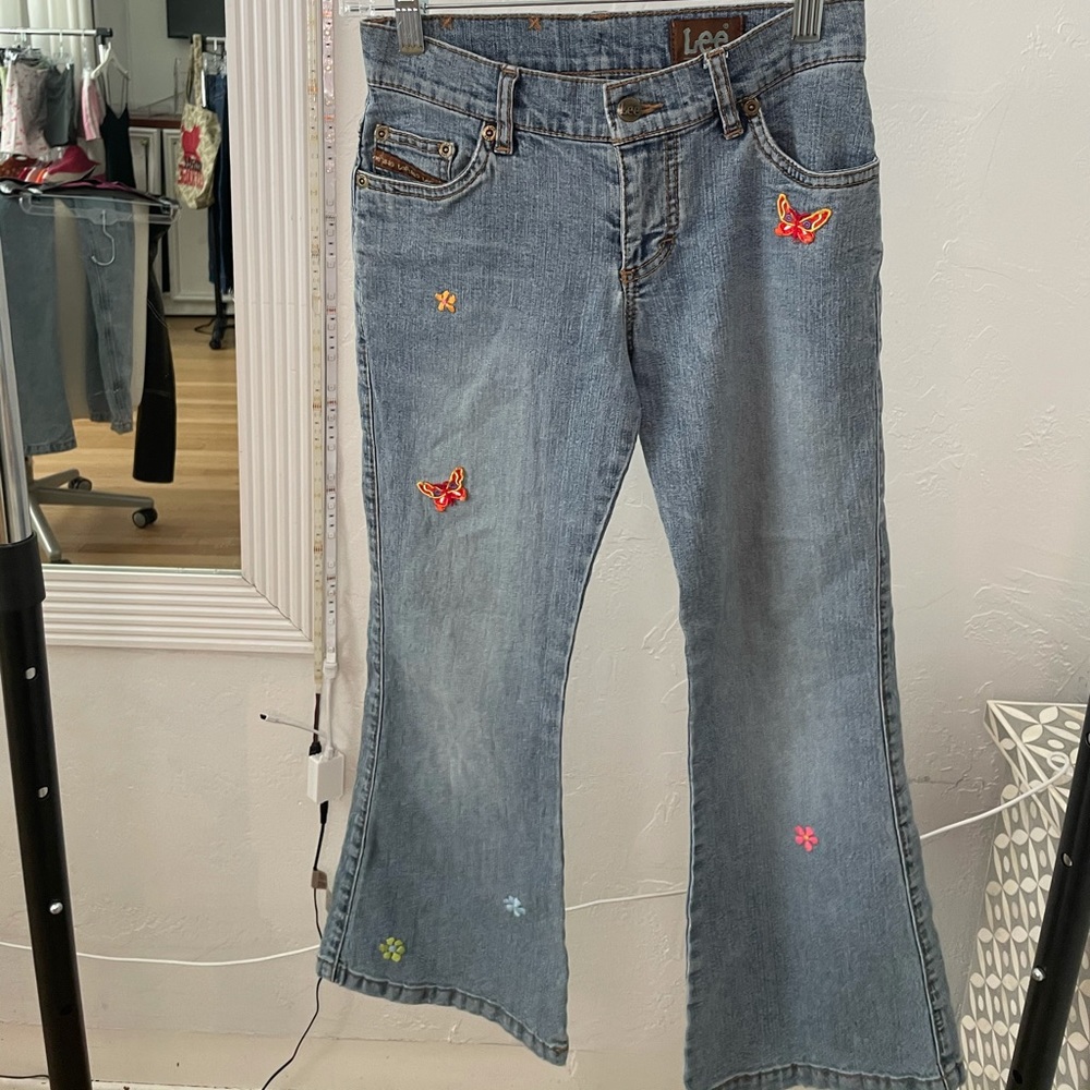 Lee jeans with butterfly/flower patches